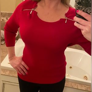 Chelsea and Theodore red sweater with zippers